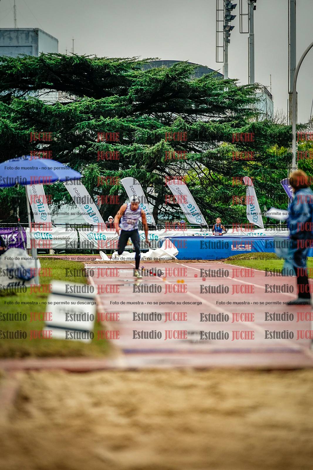Fotos del salto en largo de varones