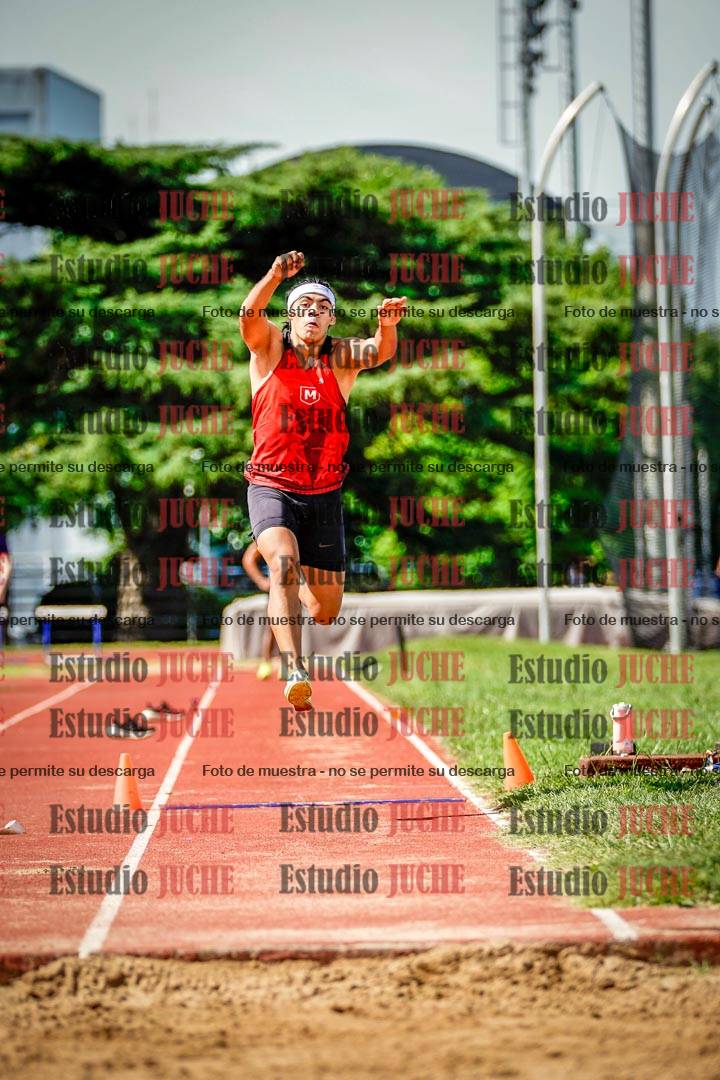 Fotos del salto triple de mujeres y varones