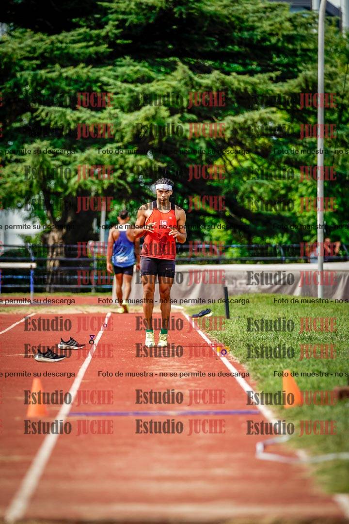Fotos del salto triple de mujeres y varones