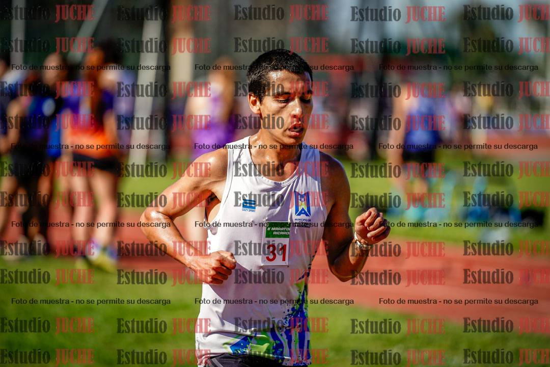 Fotos de los 5000 m llanos de mujeres y varones